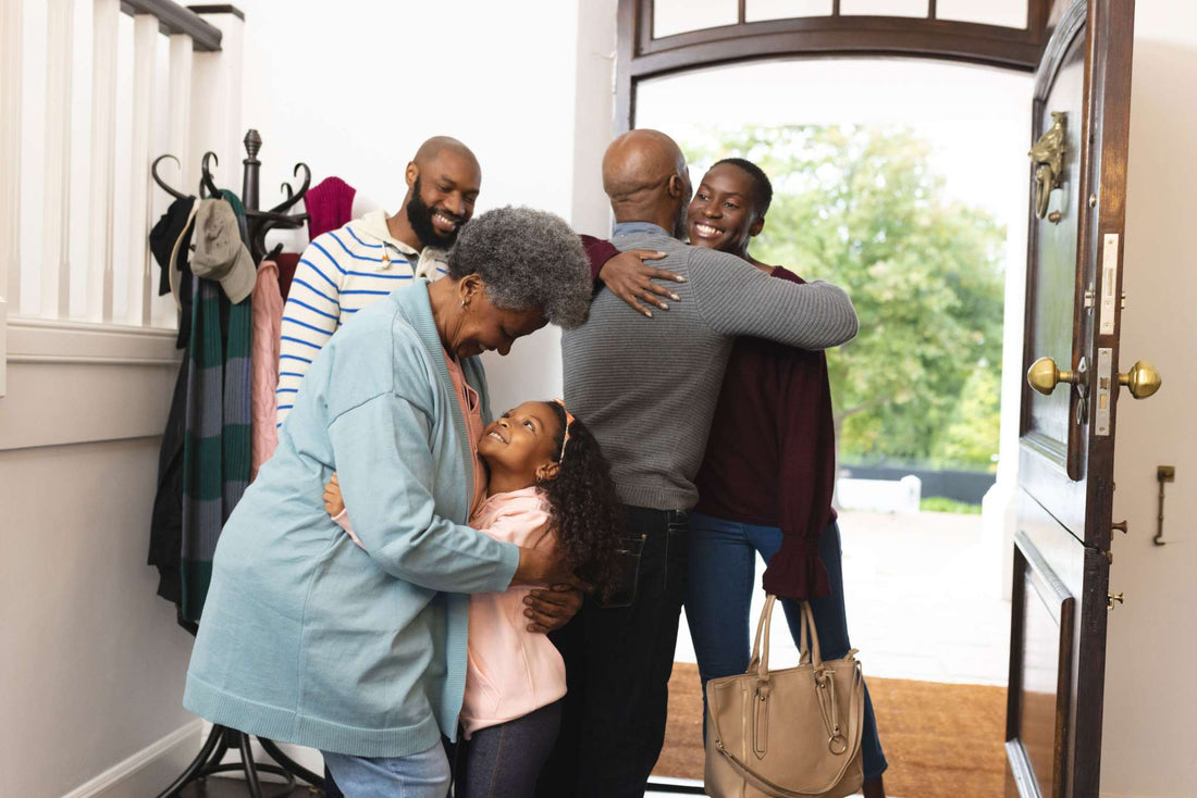 Family portrait of five people sharing hugs and smiles, with Stages of Dementia not depicted in the scene