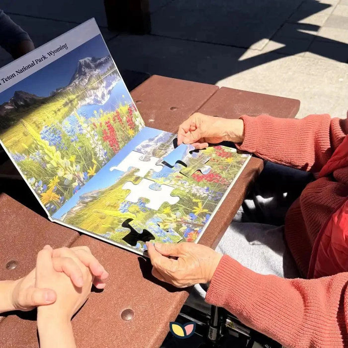 Jigsaw puzzles for seniors featuring a large-piece mountain landscape puzzle with colorful wildflowers and a reference image