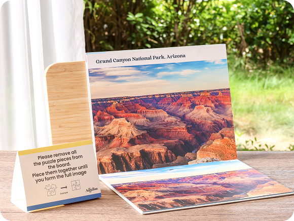 jigsaw puzzles for dementia in book style with matching pieces displayed on a tabletop outdoors. The board reads 'Grand Canyon National Park, Arizona' and shows a landscape photo of the canyon.